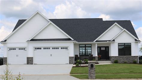 white ranch house black metal roof|white exterior house with black roof.